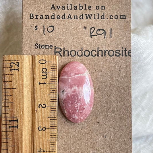 Rhodochrosite Cabochon - R91 13AC10AC-002E-4880-A2F6-C6A43BE12906 Brandedandwild.com
