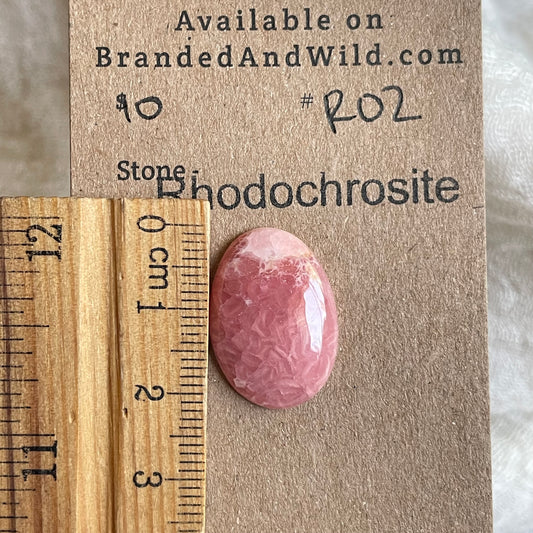 Rhodochrosite Cabochon - R02 572458DE-61AB-4379-9BBB-4F725CCE7760 Brandedandwild.com