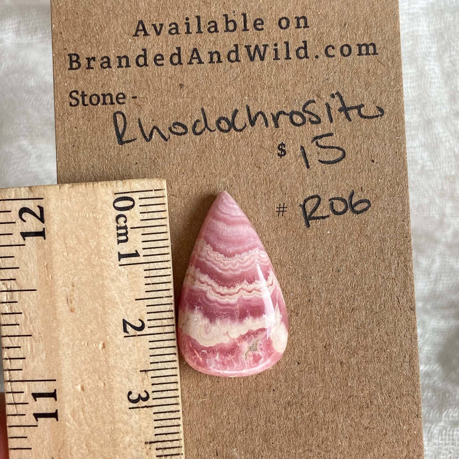 Rhodochrosite Cabochon - R06 8236EEBB-69F6-47D3-B580-DF0E023B4106 Brandedandwild.com