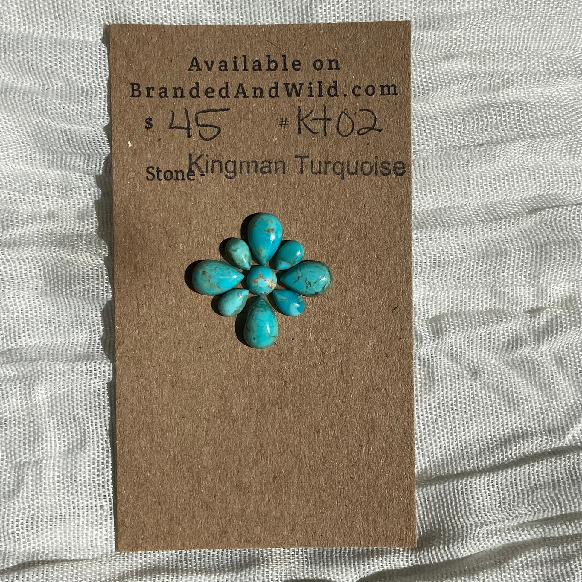 Kingman Turquoise Cabochon - KT02 87B923E4-C1B0-4FA3-ABA6-FE8F0EC32D76 Brandedandwild.com