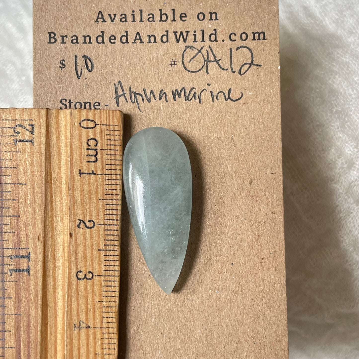 Aquamarine Cabochon AQ12 D57AAA5C-FAF6-44E3-B826-C10E4CC5A549 Brandedandwild.com