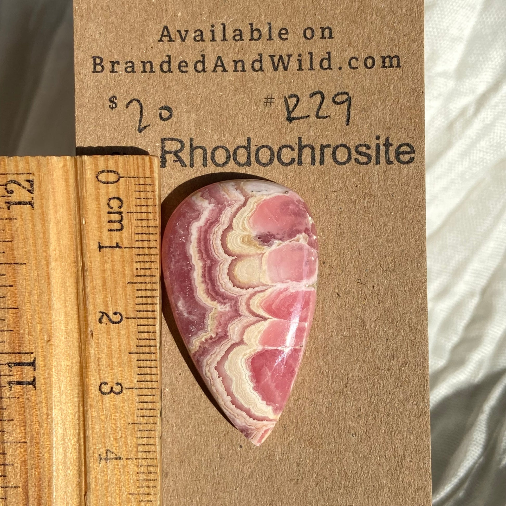 Rhodochrosite Cabochon - R29 D9C5D498-B51E-4B49-B5E3-B702D1C35542 Brandedandwild.com
