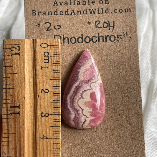 Rhodochrosite Cabochon - R14 E63097D5-014A-44D4-B7F2-4748F44B1B7F Brandedandwild.com